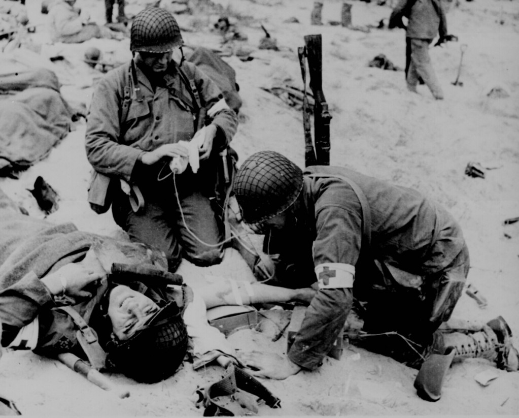 Three medics, one wounded, normandy Three medics, one wounded